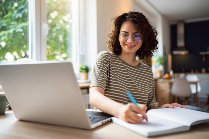 Young woman studying online on a laptop